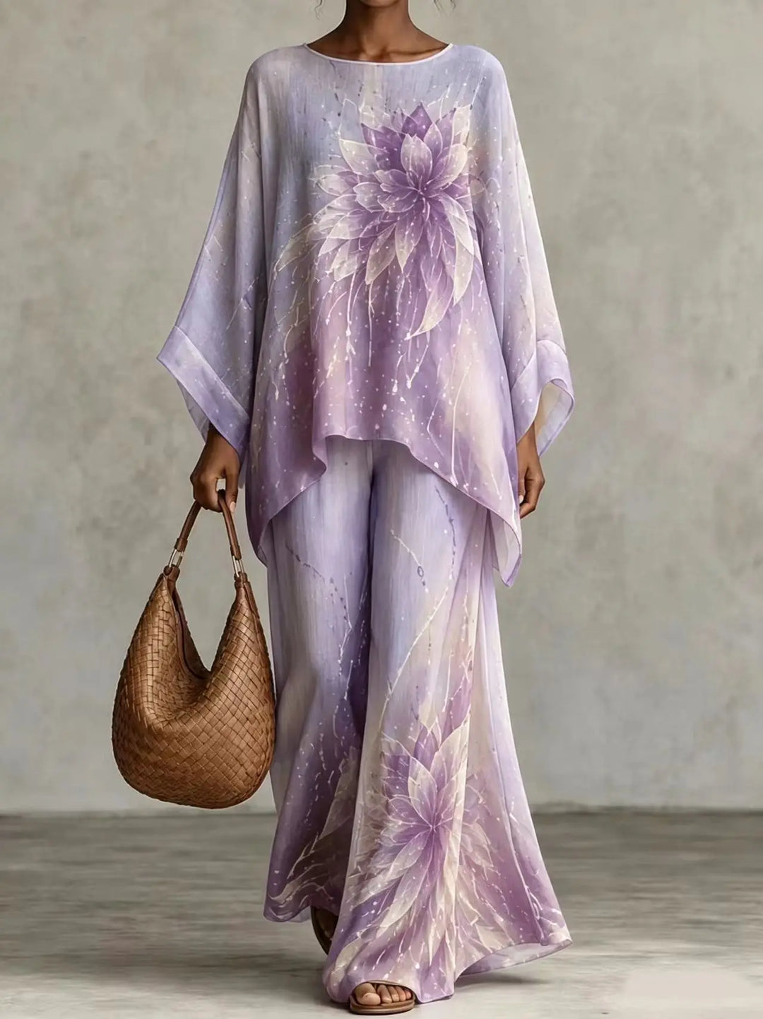 Woman wearing purple floral print asymmetric top and wide leg pants