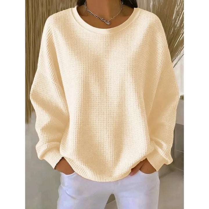 Woman wearing beige waffle knit oversized top
