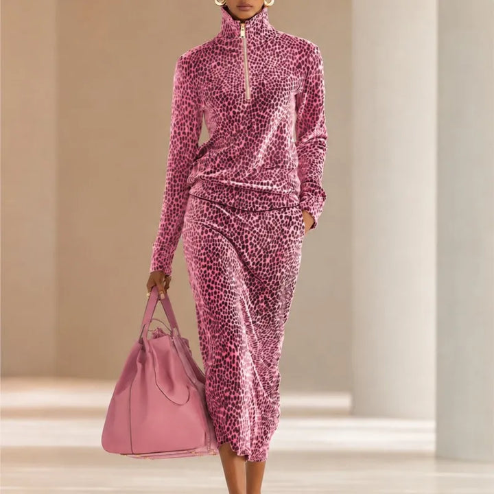 Woman in pink leopard print half-zip top and midi skirt set
