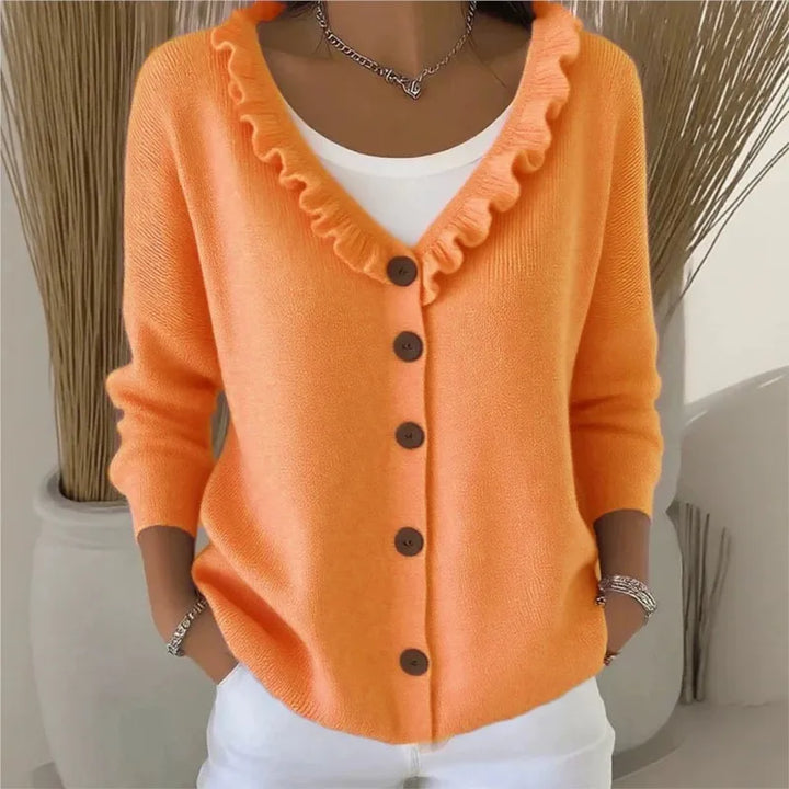 Orange ruffle V-neck button front cardigan on model