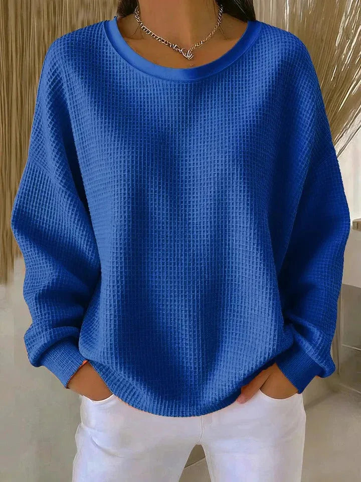 Woman wearing blue waffle knit oversized top