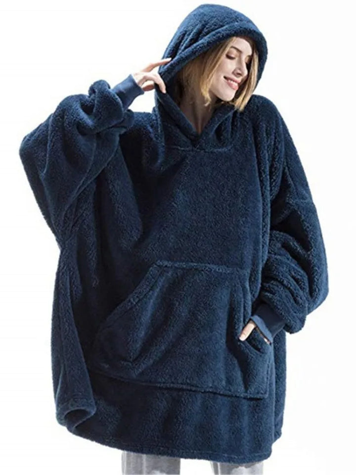 Woman wearing navy blue oversized hooded blanket sweatshirt