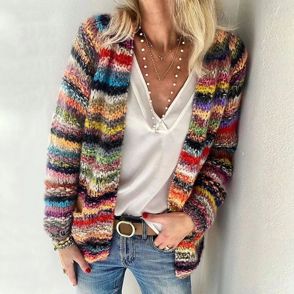 Woman wearing multicolor striped open-front cardigan, red colorway, front view