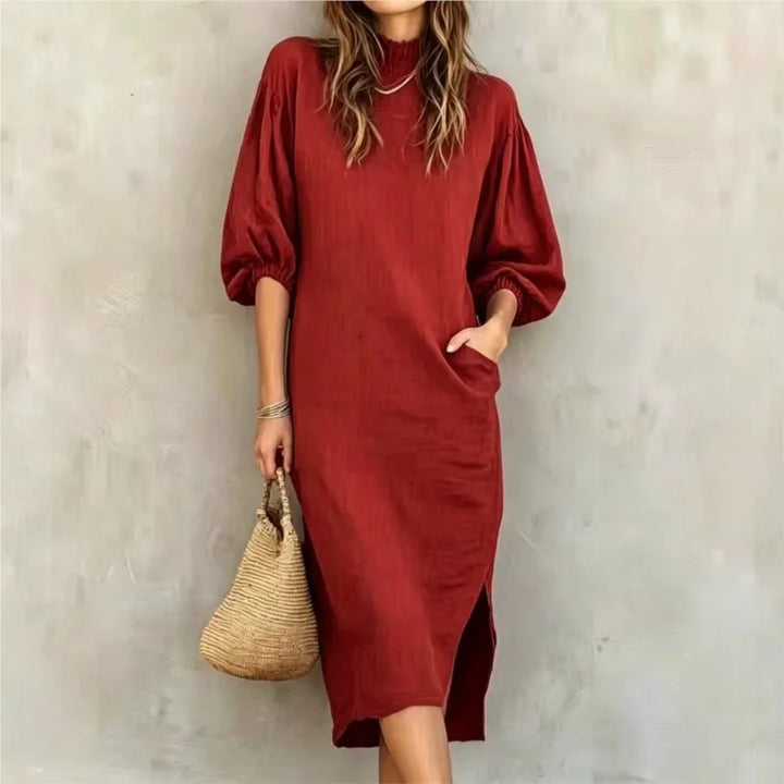 Woman wearing red mock neck midi dress with balloon sleeves, front view