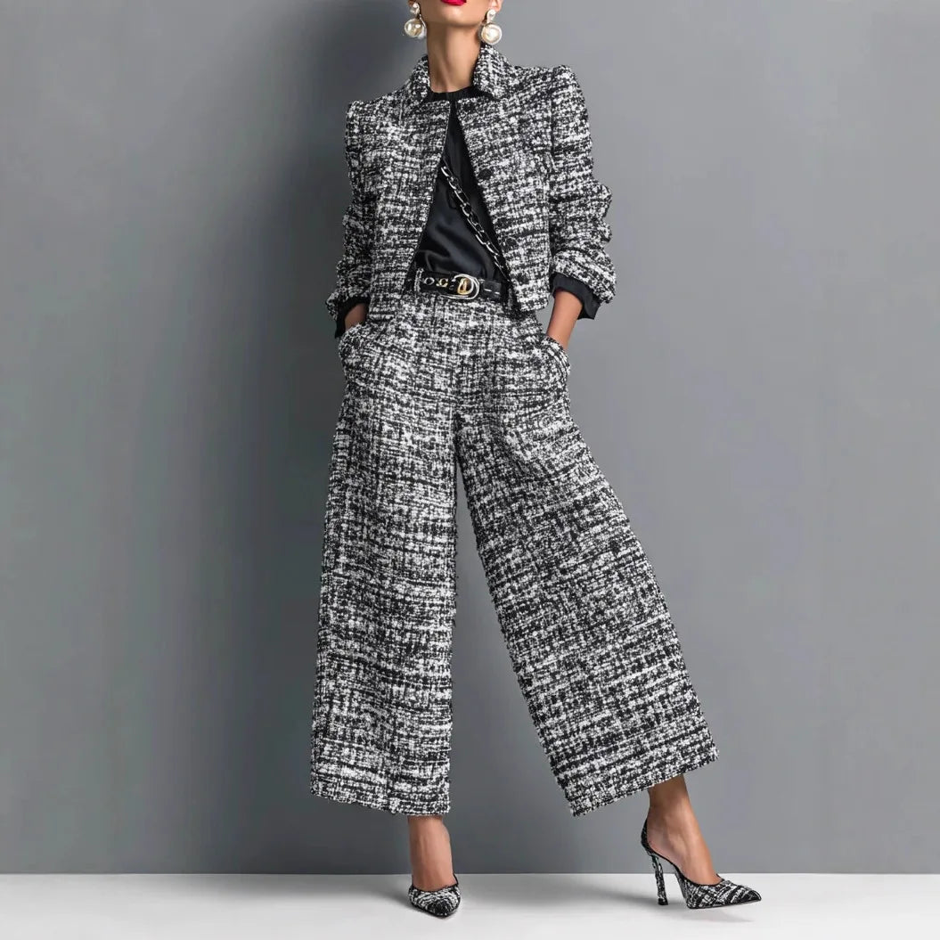 Woman wearing black and white tweed cropped jacket and wide leg pants set