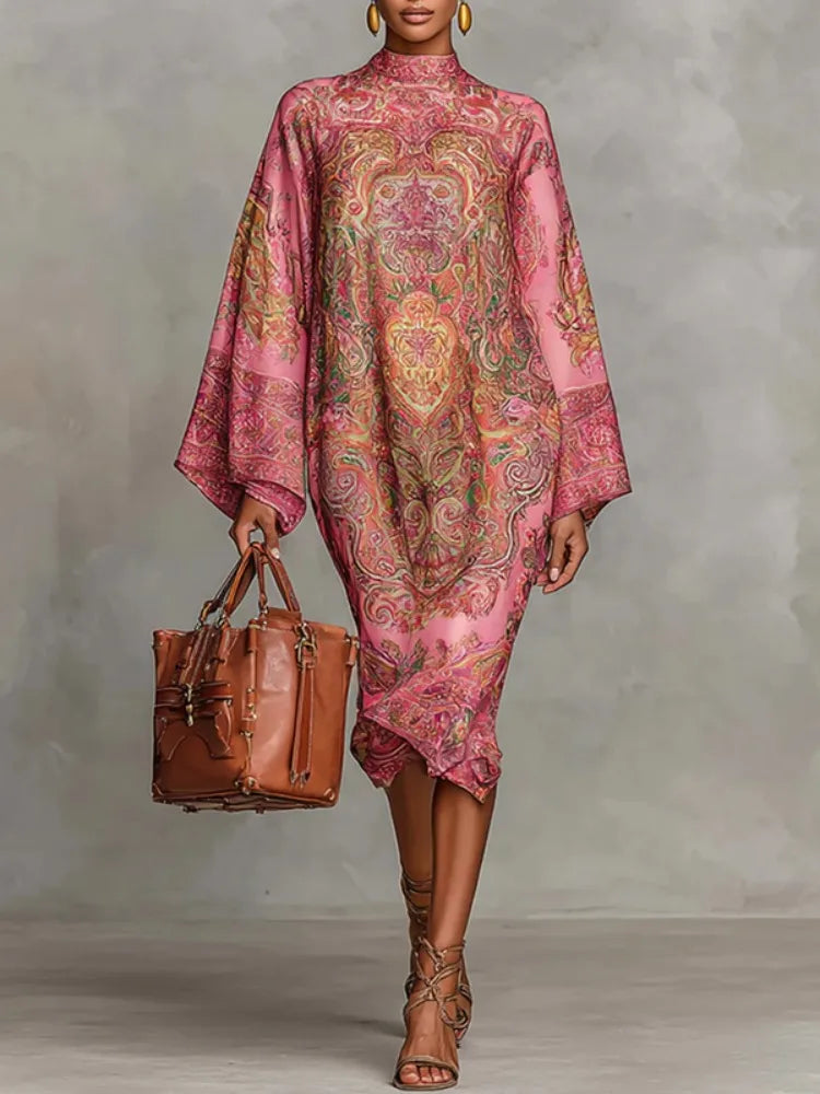 Woman wearing pink paisley print kaftan midi dress, front view