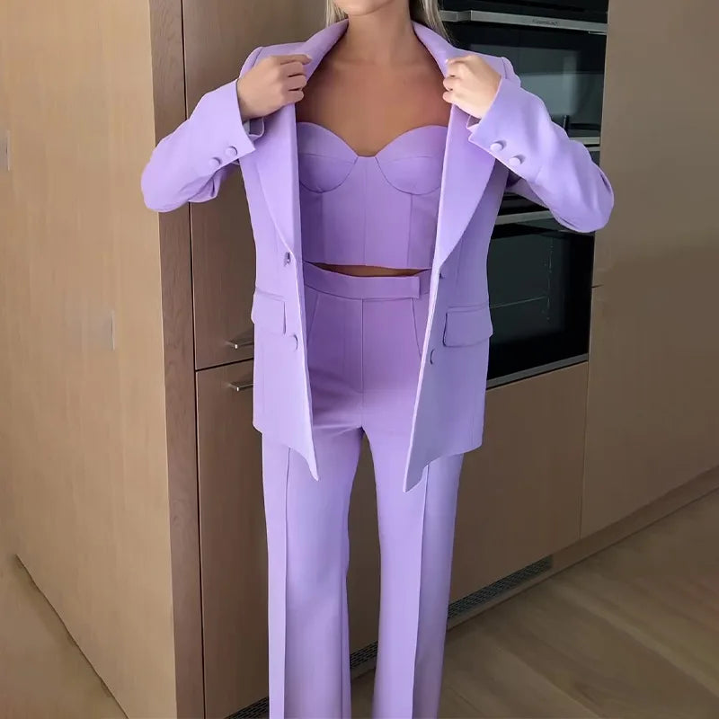 Lavender blazer worn open over bustier top and trousers