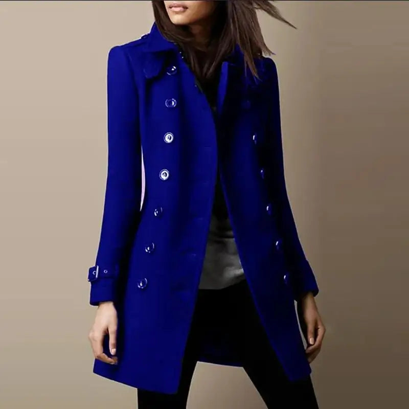 Woman wearing a blue double-breasted mid-length coat, front view