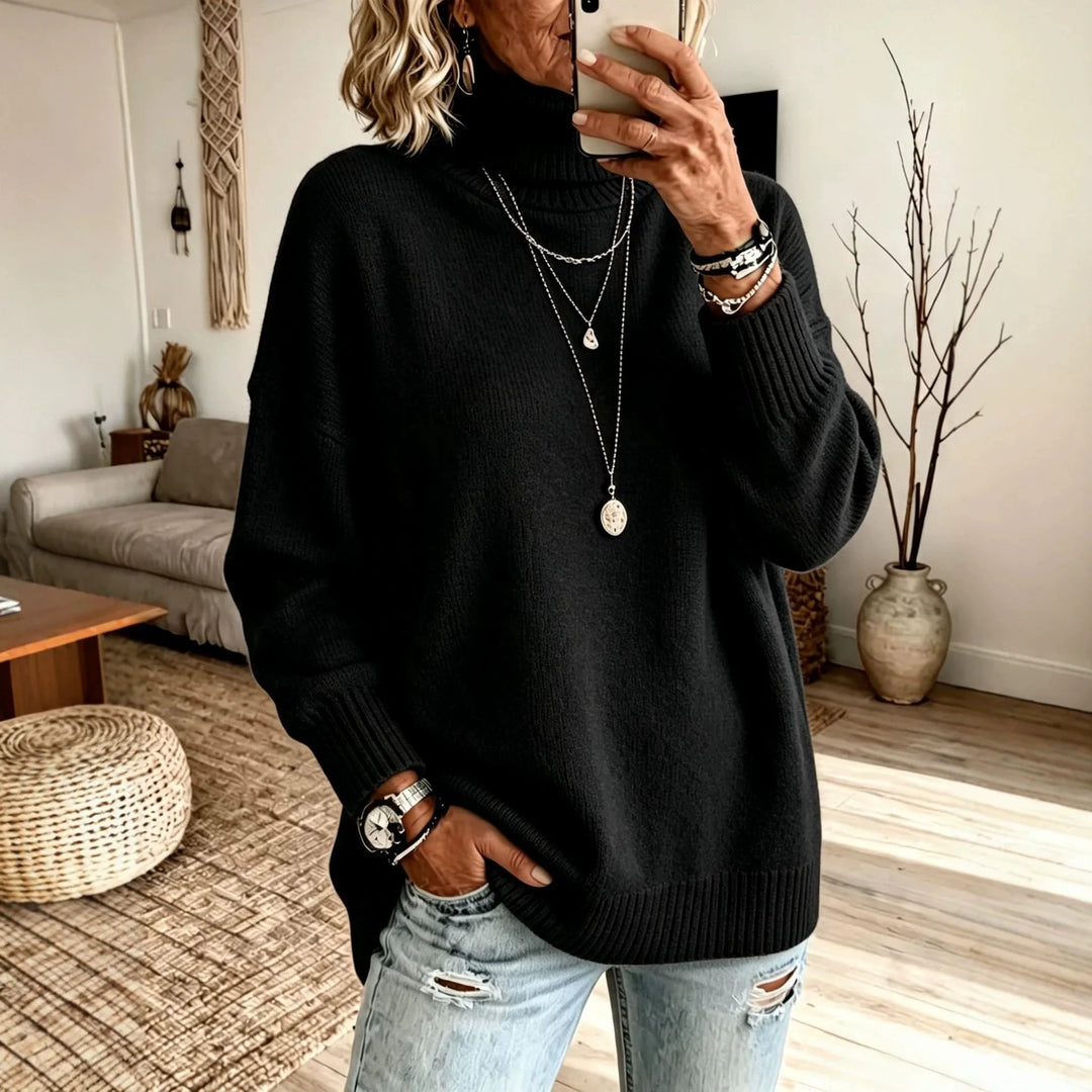 Woman wearing black oversized turtleneck sweater