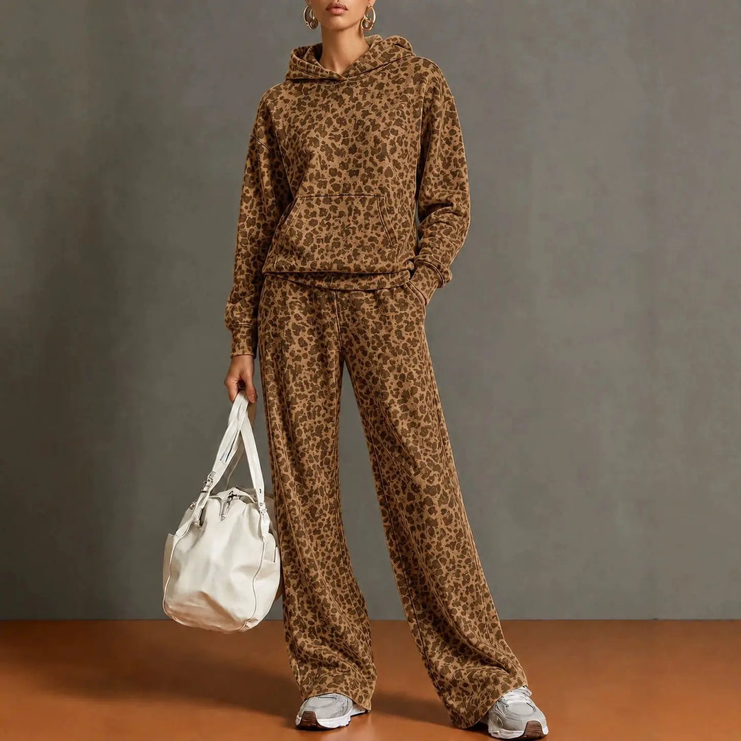Woman wearing brown leopard print hooded sweatshirt and wide leg pants set