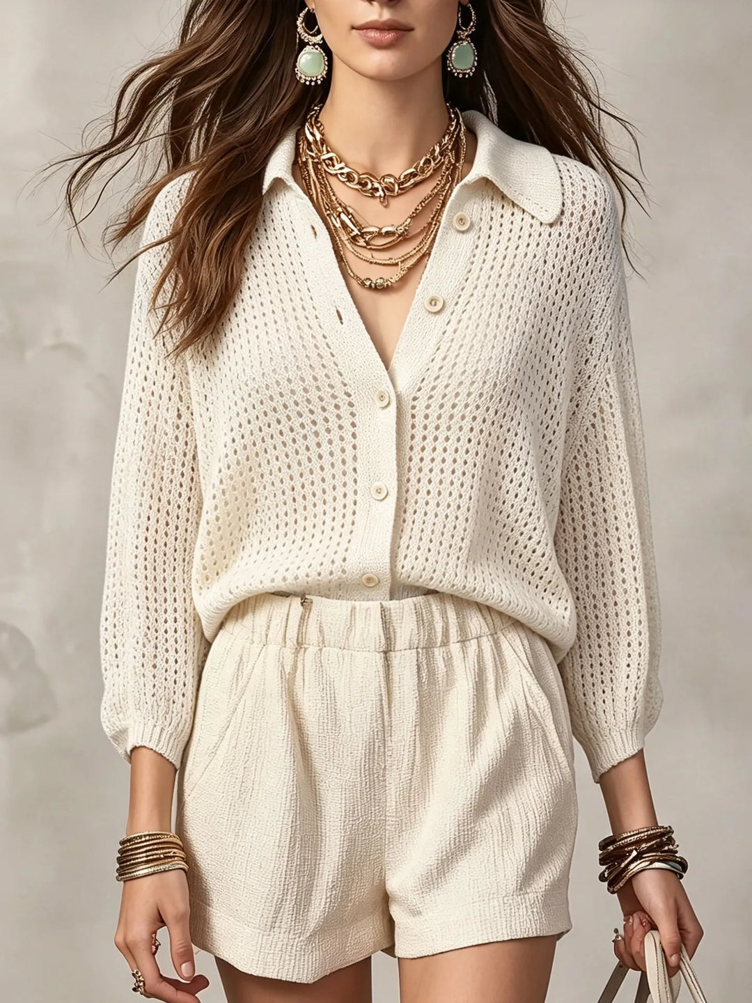 Woman wearing white open crochet knit cardigan with collar and buttons, front view