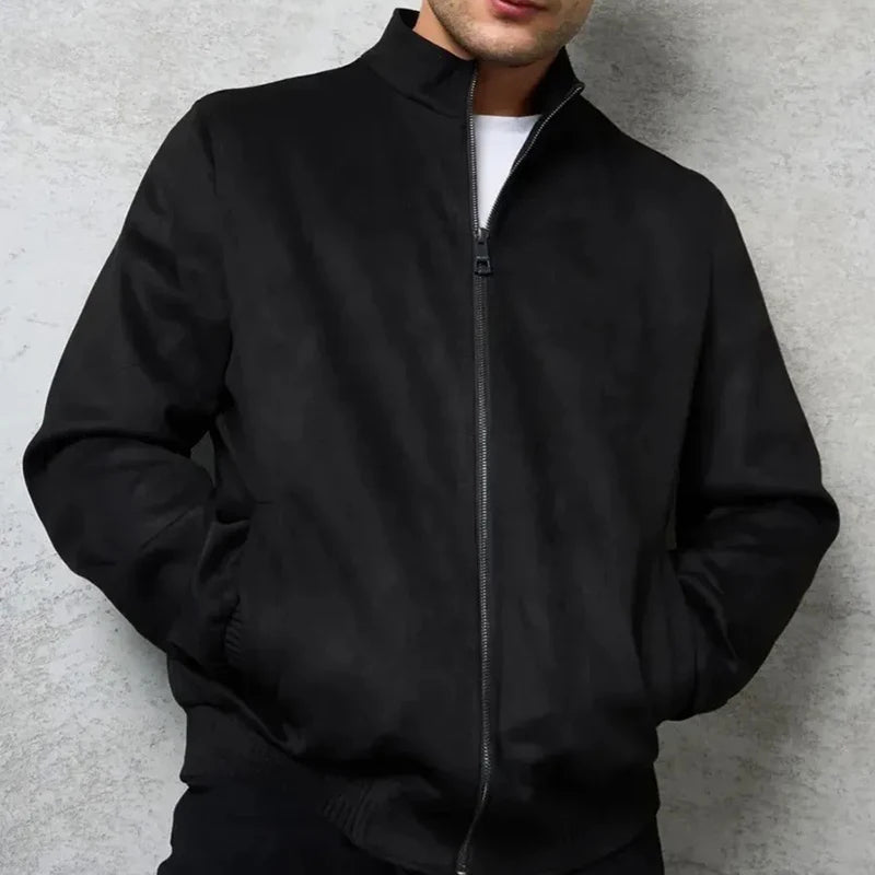 Man wearing black suede bomber jacket zipped up
