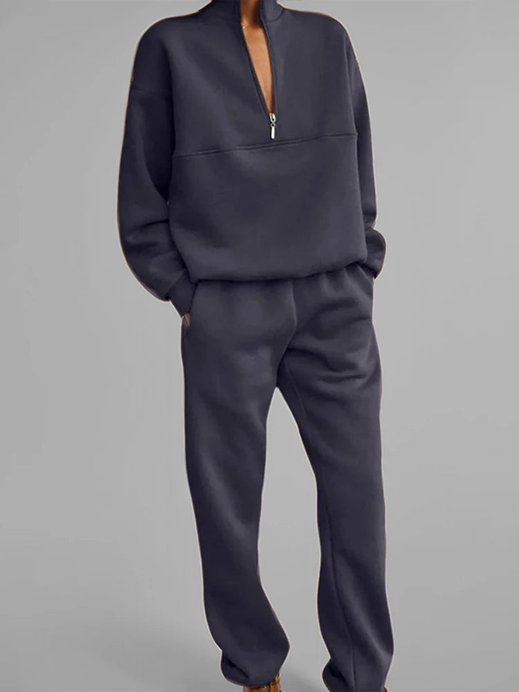 Woman wearing navy blue half-zip pullover and jogger set