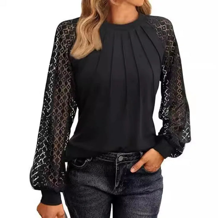 Black pullover blouse with pintuck pleats and lace sleeves, front view