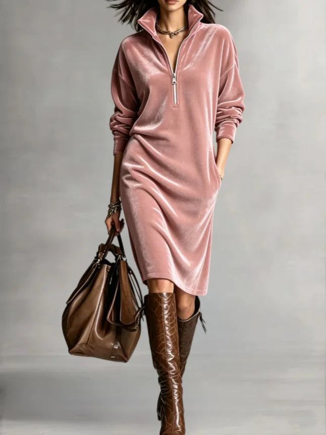 Woman in pink velvet half-zip midi dress