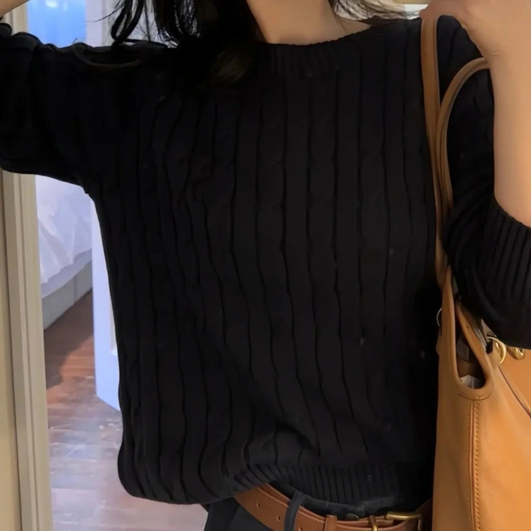 Black cable knit crew neck sweater on model