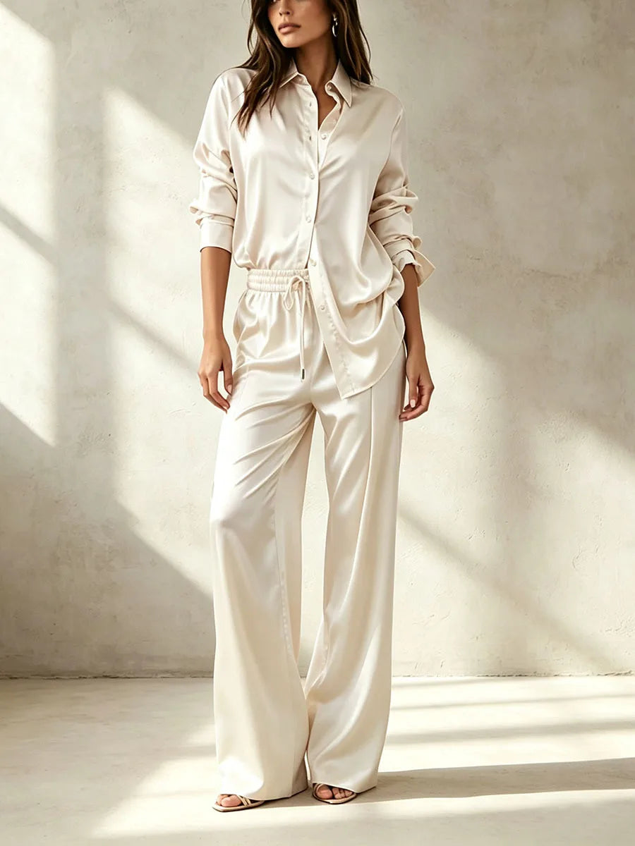 Woman wearing beige satin shirt and pant set, front view