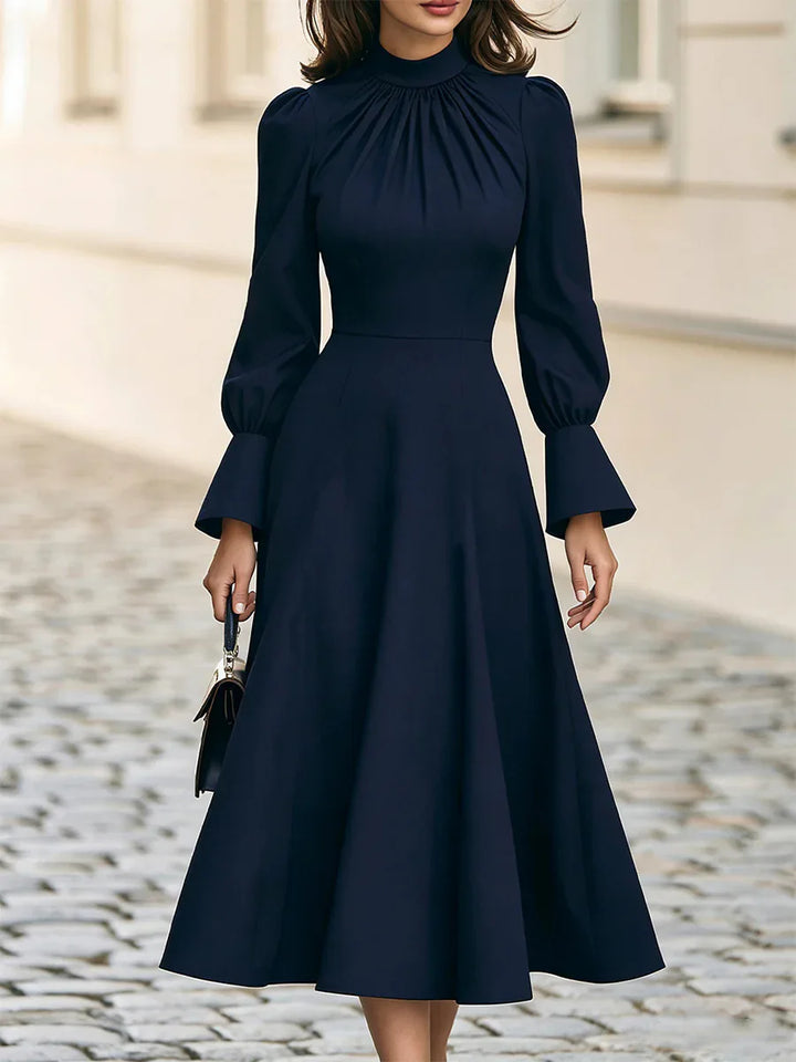 Navy blue midi dress with ruched mock neck detail, close up front view