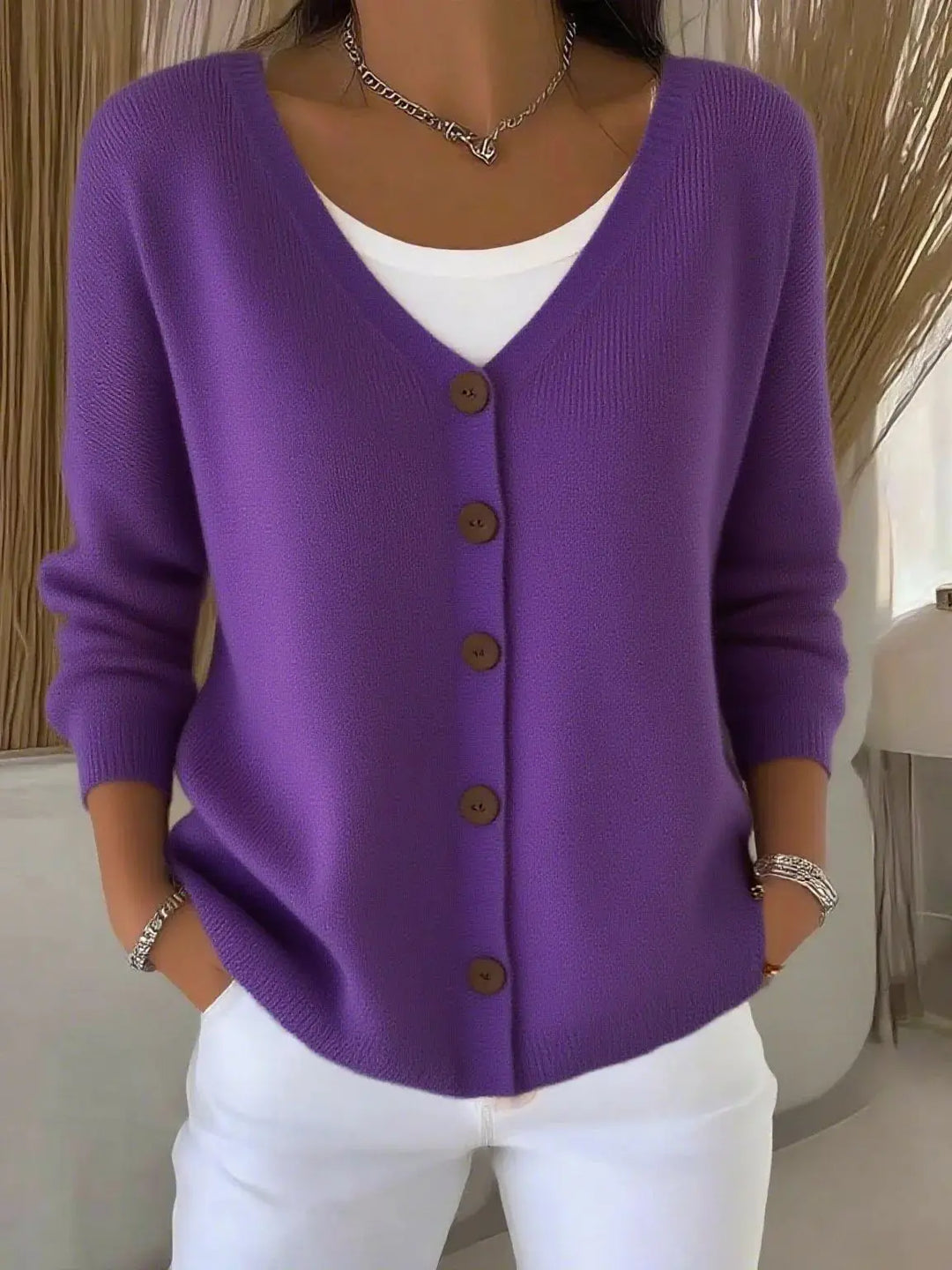 Woman wearing purple button front knit cardigan