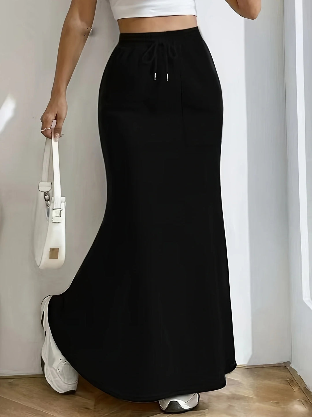 Black mermaid hem maxi skirt front view with drawstring waist