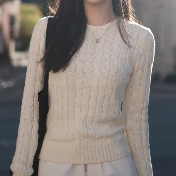 Cream cable knit crew neck sweater on model