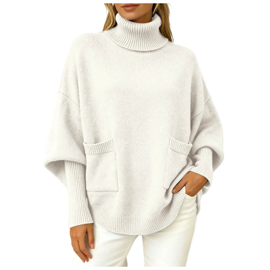 Woman wearing white oversized turtleneck sweater with front pockets