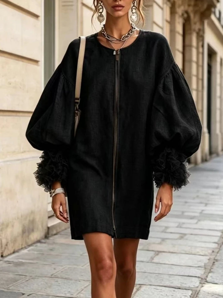 Black mini dress with balloon sleeves and ruffle cuffs