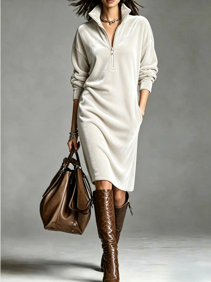 Woman in white velvet half-zip midi dress