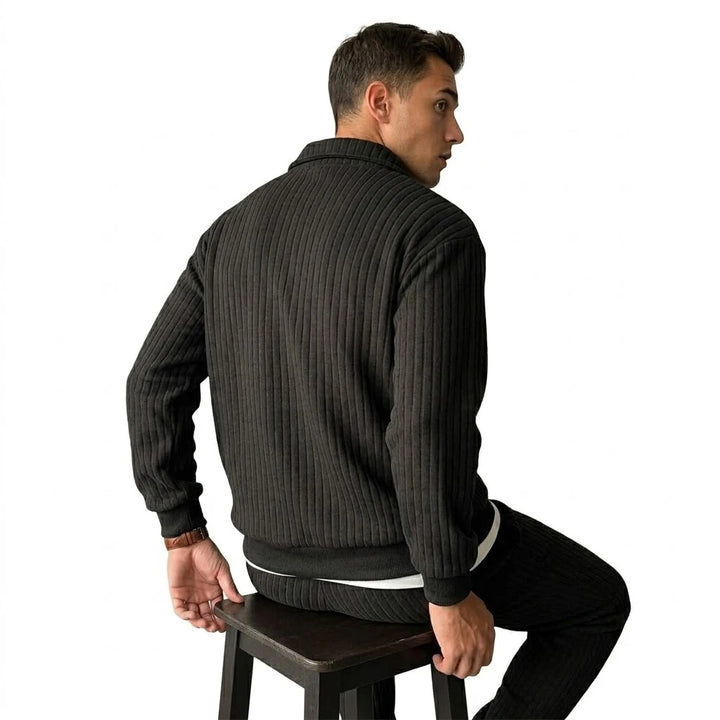 Back view of black ribbed quarter-zip pullover