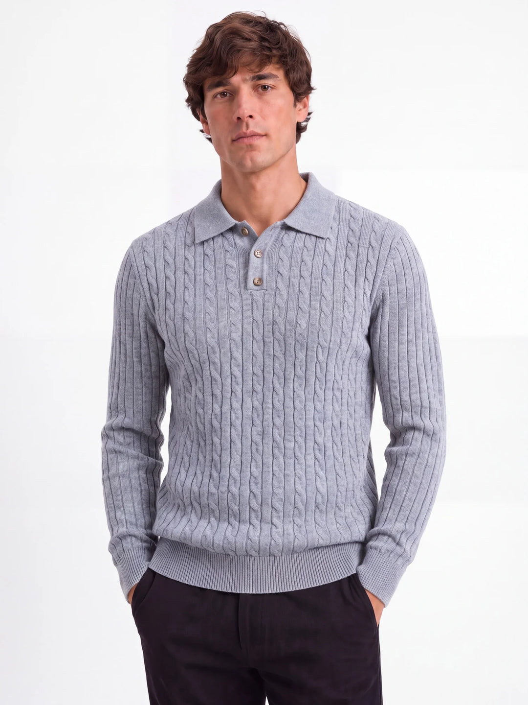 Man wearing light grey cable knit polo sweater