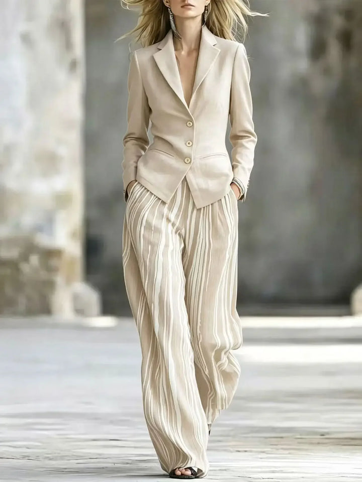 Woman wearing apricot blazer with striped wide leg pants suit