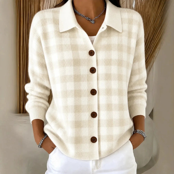 Woman wearing cream plaid knit button-front cardigan with point collar