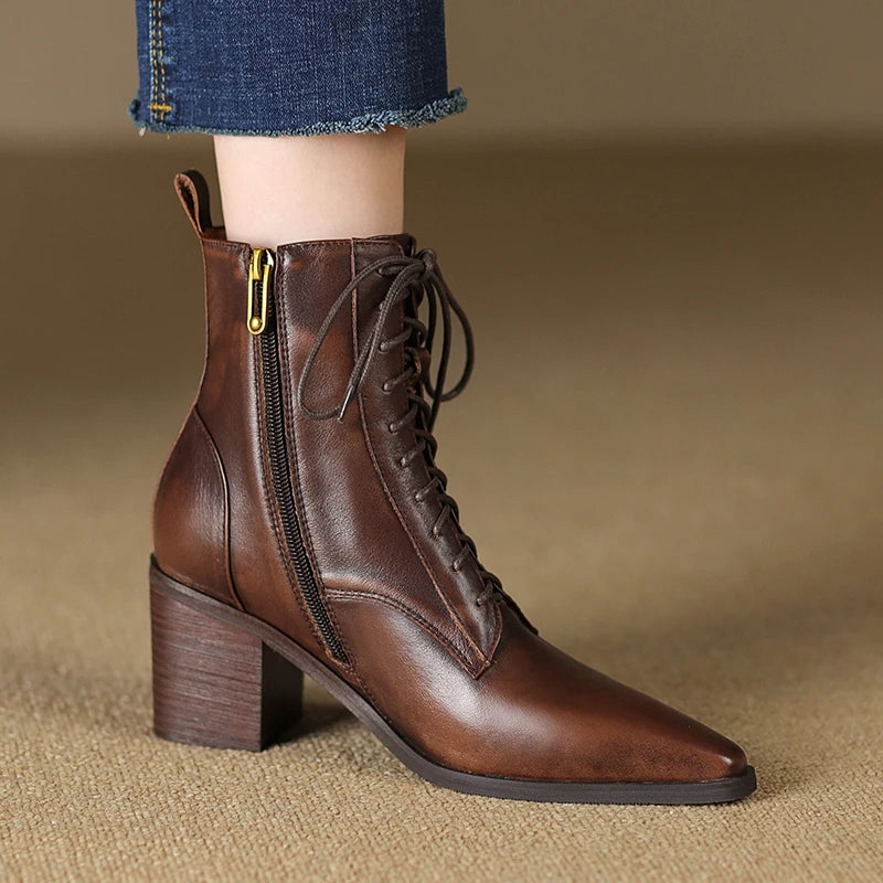Brown leather lace-up ankle boot side view on model