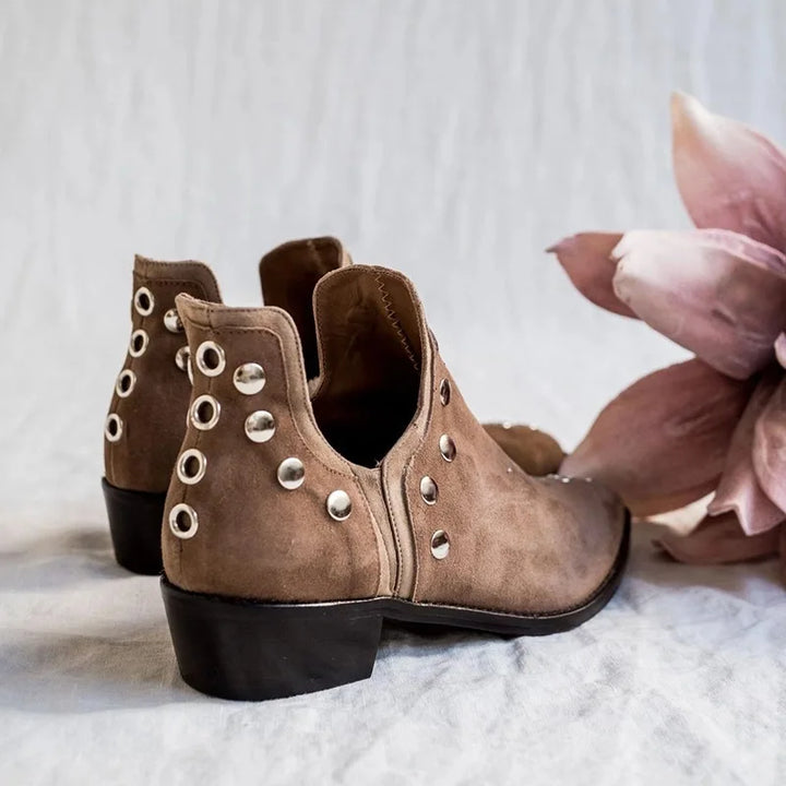 Back view of khaki suede ankle boots with grommet detail