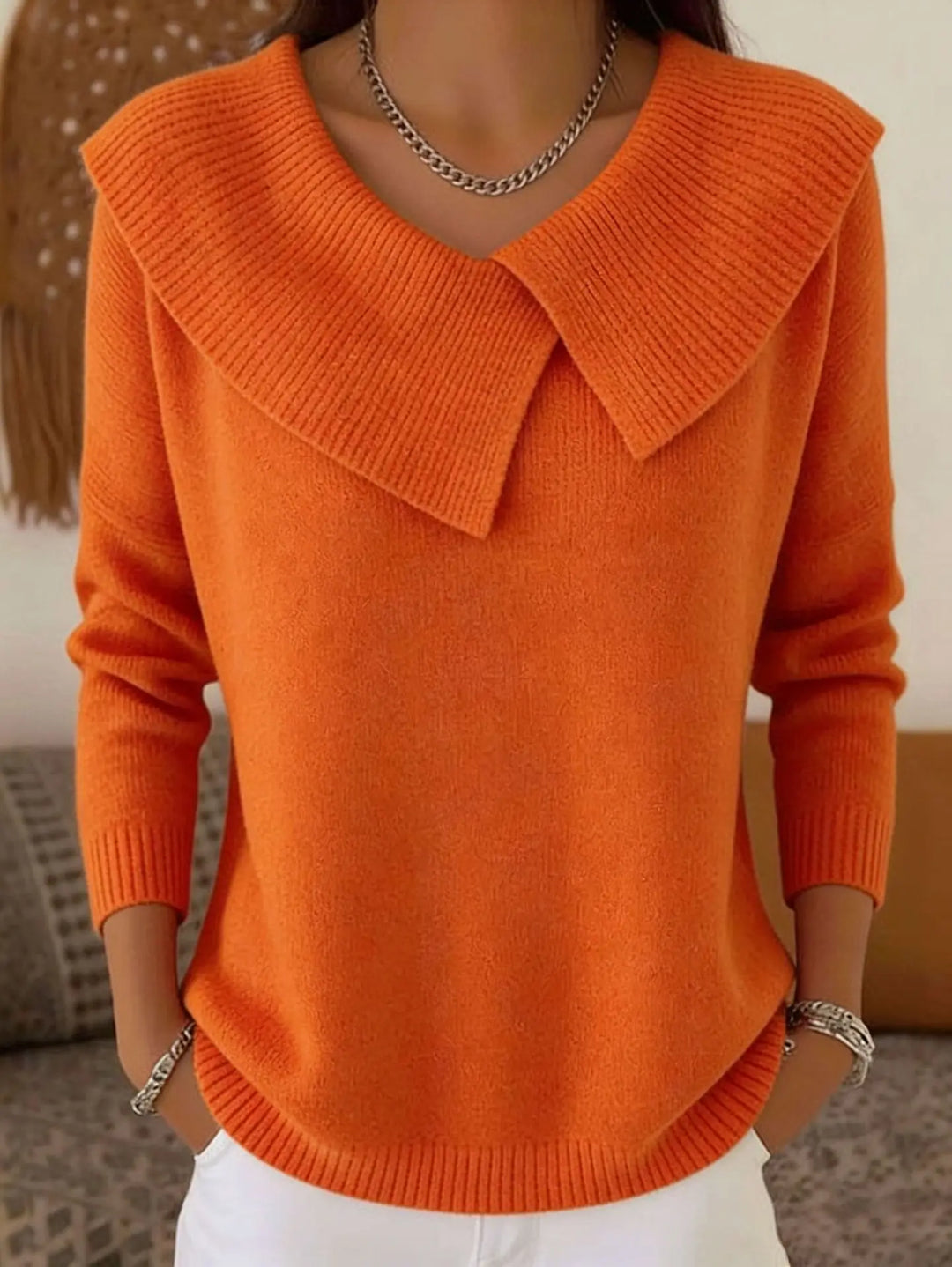 Orange sweater with oversized draped collar, front view
