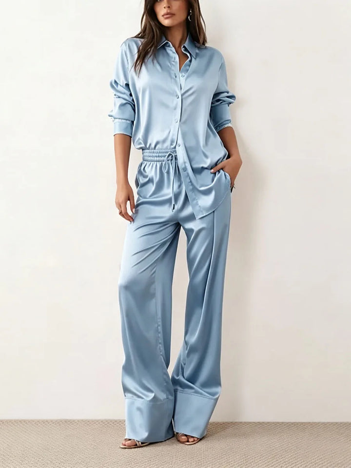 Woman wearing sky blue satin two piece set, front view