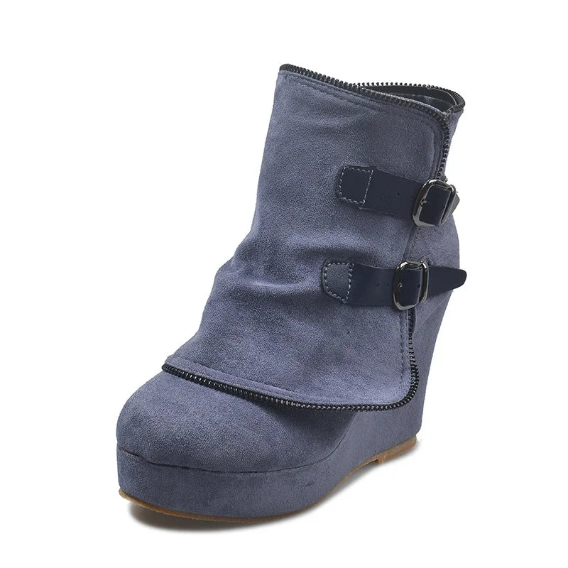 Blue suede wedge ankle boot on white background