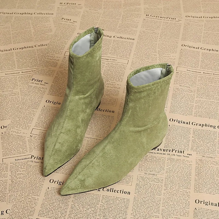 Light green suede ankle boots pair