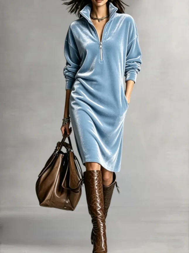 Woman in light blue velvet half-zip midi dress