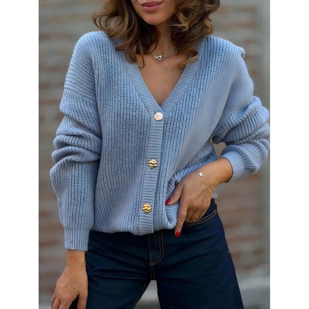 Woman wearing light blue ribbed knit button front cardigan
