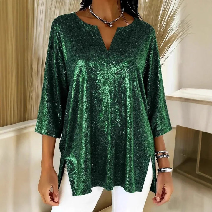 Woman wearing green shimmer oversized blouse with V-neck