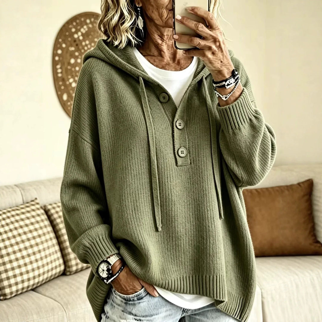 Woman wearing army green ribbed knit hooded sweater