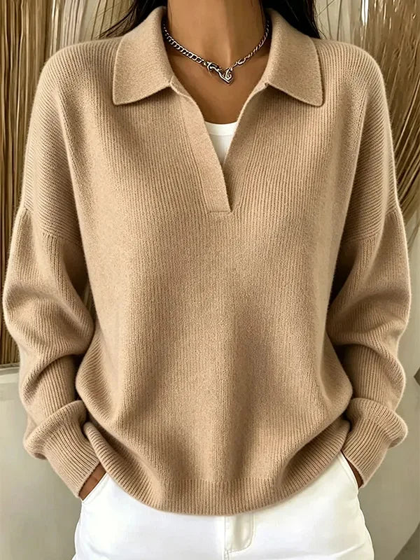 Woman wearing khaki ribbed knit polo sweater with deep V neckline