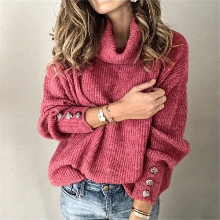 Woman wearing brick red ribbed turtleneck sweater with button cuffs