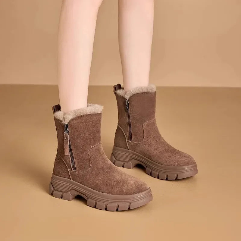 Brown suede snow boots with faux fur cuff and side zip