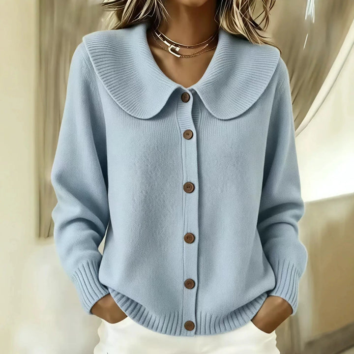 Woman wearing sky blue wide collar button front cardigan
