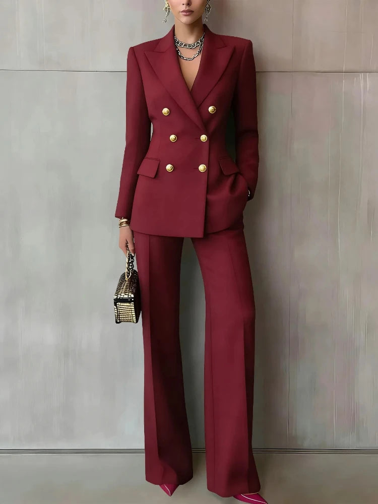 Woman wearing claret double-breasted blazer and wide leg pants suit