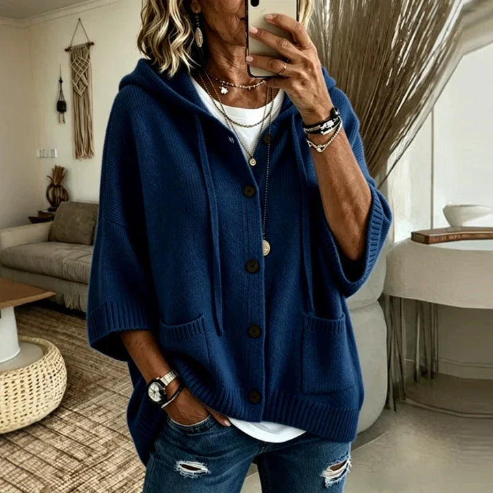 Woman wearing navy blue hooded button-front cardigan