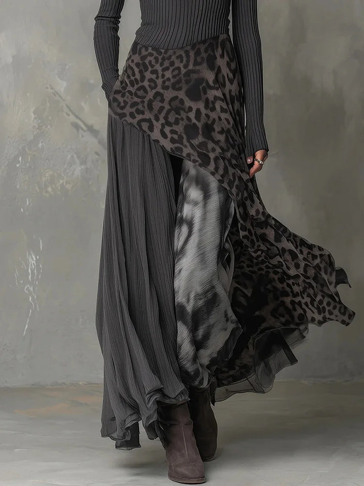 Close up of leopard print patchwork skirt detail on gray maxi dress