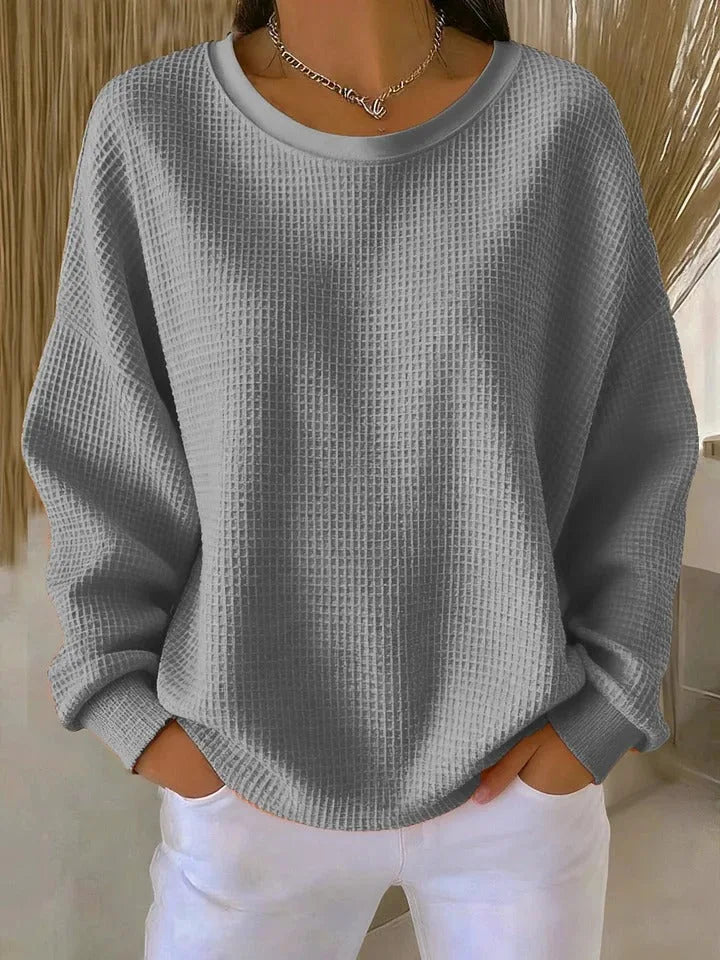 Woman wearing gray waffle knit oversized top
